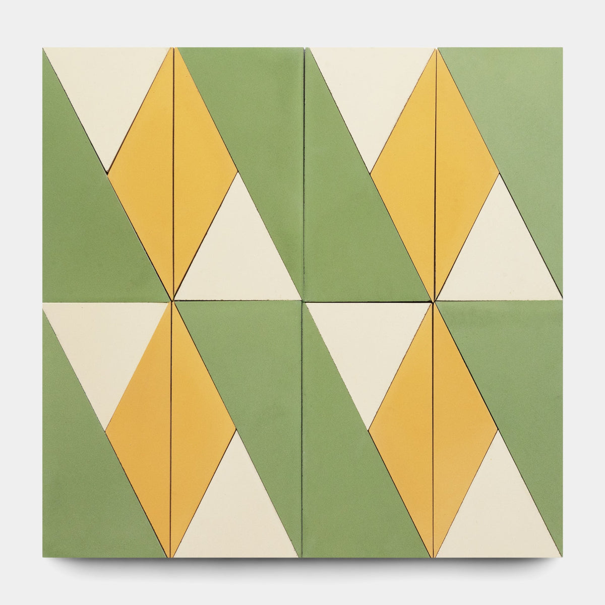 The Kepler Set Two, Sample by Zia Tile features four square cement tiles in a grid, each with yellow, green, and off-white triangles forming diamond shapes for a symmetrical, repeating pattern and handmade tile look.