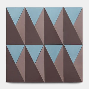 The Kepler Set Three by Zia Tile features geometric wall art with eight rectangles showcasing interlocking blue and brown triangles in a repeating abstract pattern inspired by classic Zia Tile ceramic designs on a white background.