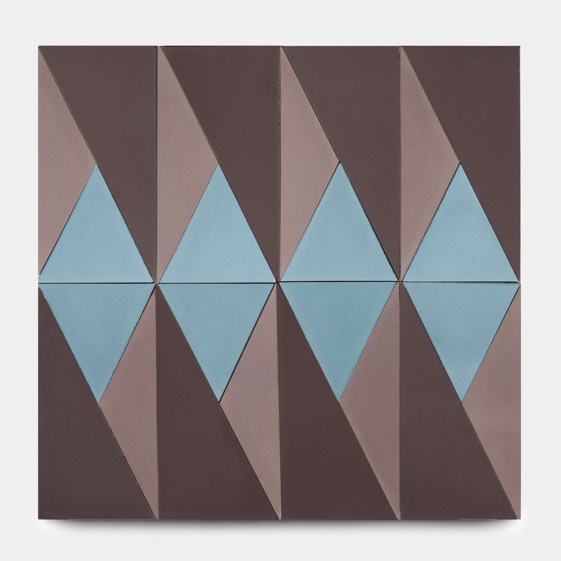 Kepler Set Three by Zia Tile is a geometric abstract artwork inspired by ceramic tile design, with repeating blue and brown diamonds and triangles in a symmetrical, grid-like pattern on a square canvas.