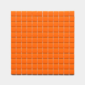 A grid of 100 Kumquat 1x1 tiles by Zia Tile is arranged in a 10 by 10 square on a white background.