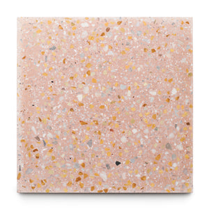 Las Palmas 6x6 Sample by Zia Tile: a square pink terrazzo tile with yellow, white, and gray stone and marble chips on a white base. A unique handmade accent for any space.