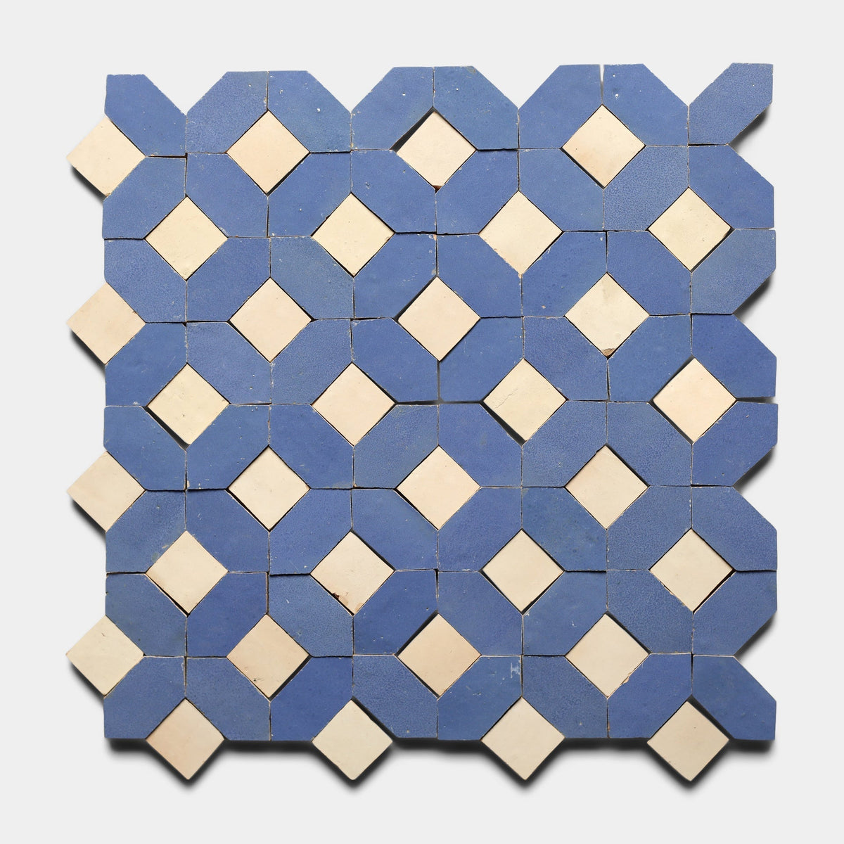 The Lattice 3, Sample by Zia Tile features a geometric pattern of alternating blue octagons and white diamond shapes on a light background, creating a signature repeating Zia Tile design.