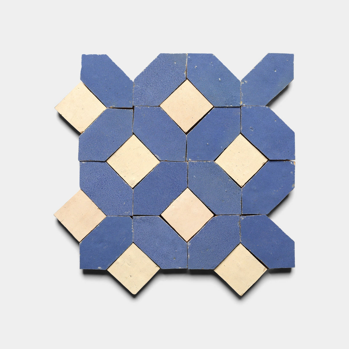 Lattice 3, Sample by Zia Tile features blue octagonal and cream diamond-shaped tiles in an interlocking geometric grid on a light gray background.