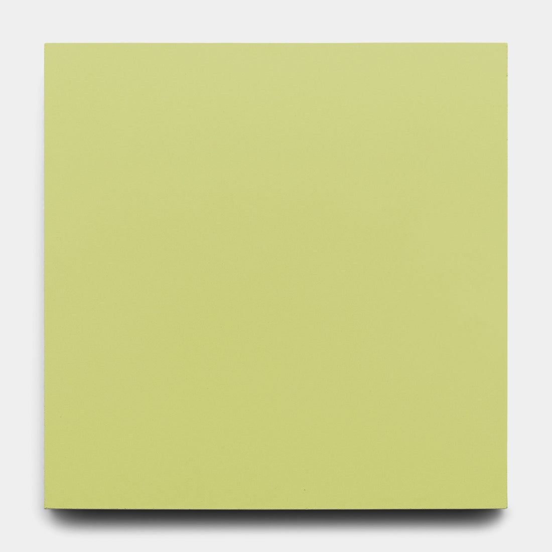 A blank, rectangular canvas painted in a pale yellow-green, echoing the Lemongrass 8x8 by Zia Tile, is centered against a plain white background.