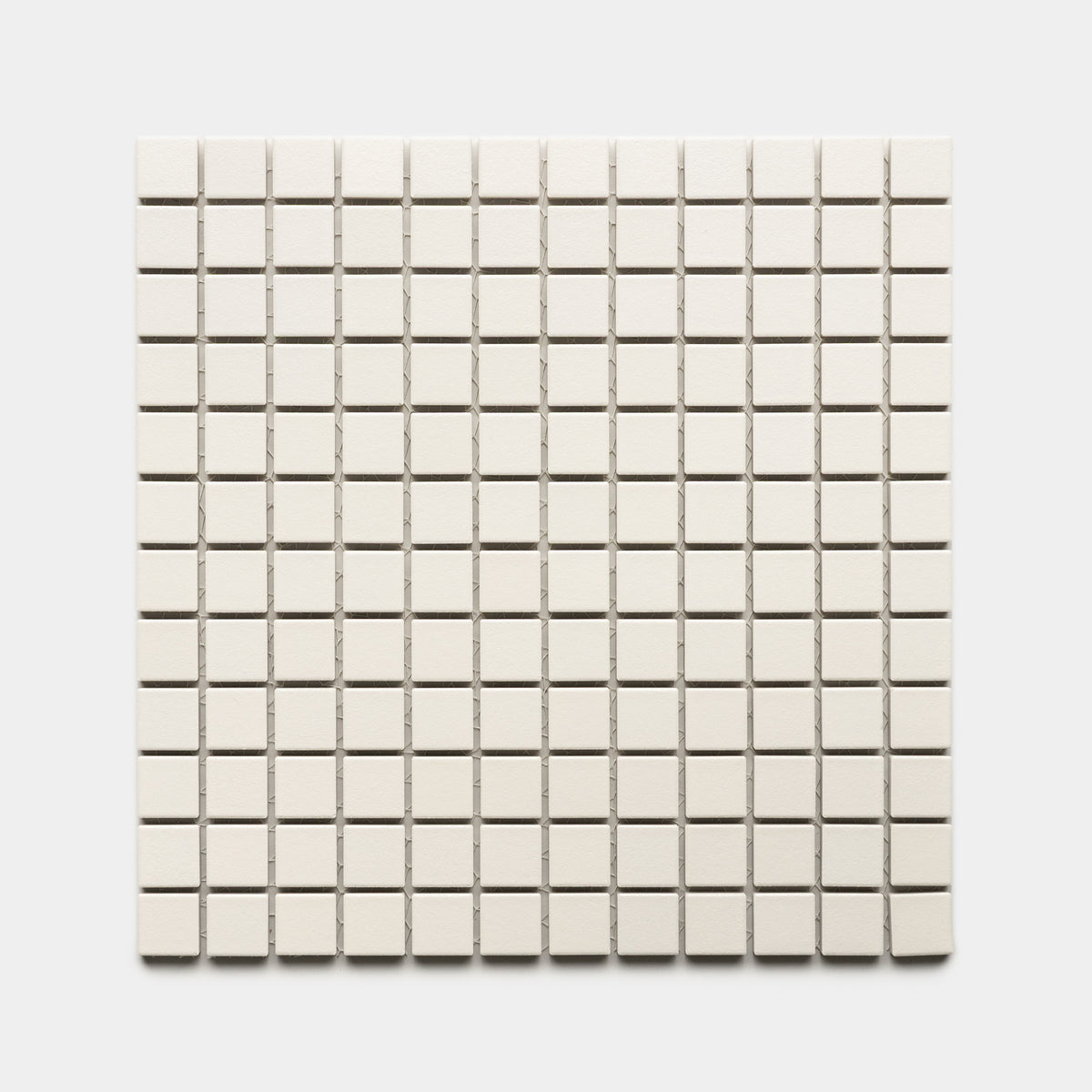 Linen 1x1 by Zia Tile features small, square, off-white tiles arranged in an even grid of rows and columns on a white background.