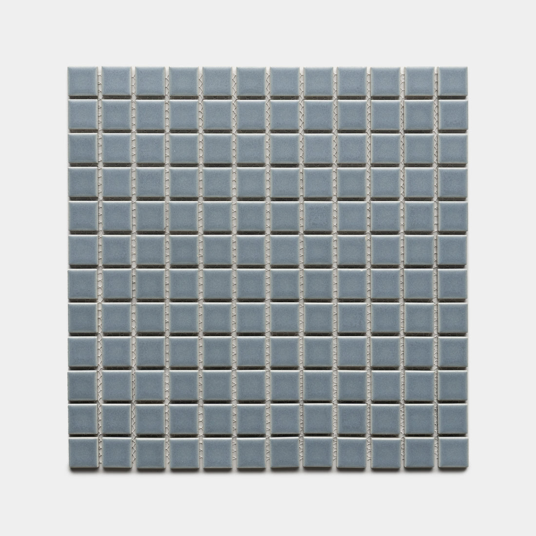 Loch 1x1 by Zia Tile features small, light blue ceramic tiles in a square grid with white grout lines, evenly arranged on a light background.