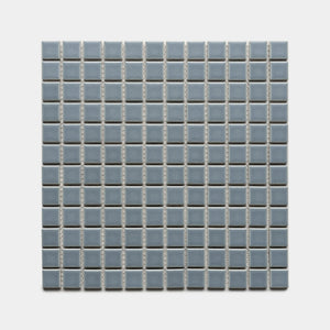Loch 1x1 by Zia Tile features small, light blue ceramic tiles in a square grid with white grout lines, evenly arranged on a light background.