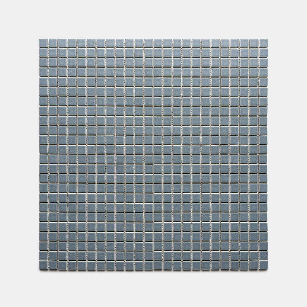 Loch 1x1 by Zia Tile features small, square, light blue tiles arranged evenly on a white background, creating a clean and geometric pattern.