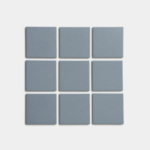 Nine evenly spaced Loch 4x4 blue-gray square tiles by Zia Tile are arranged in a 3x3 grid on a plain white background.