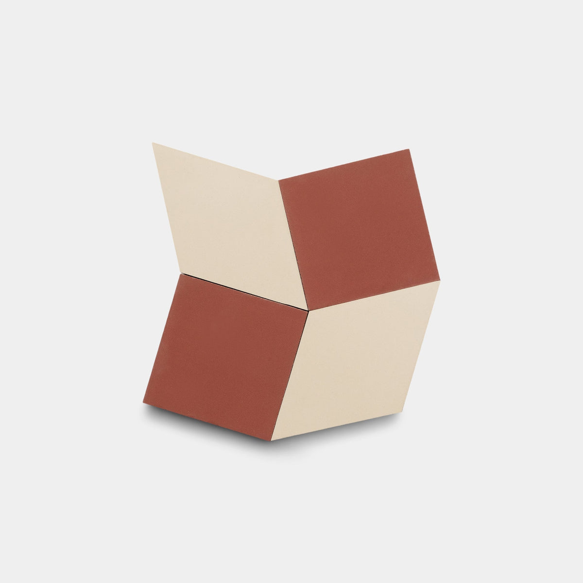 The Madrid Canyon + Bone sample from Zia Tile features four connected, diamond-shaped blocks in cream and reddish-brown, forming a geometric, three-dimensional sculpture reminiscent of Zia Tile's cement tile designs on a white background.
