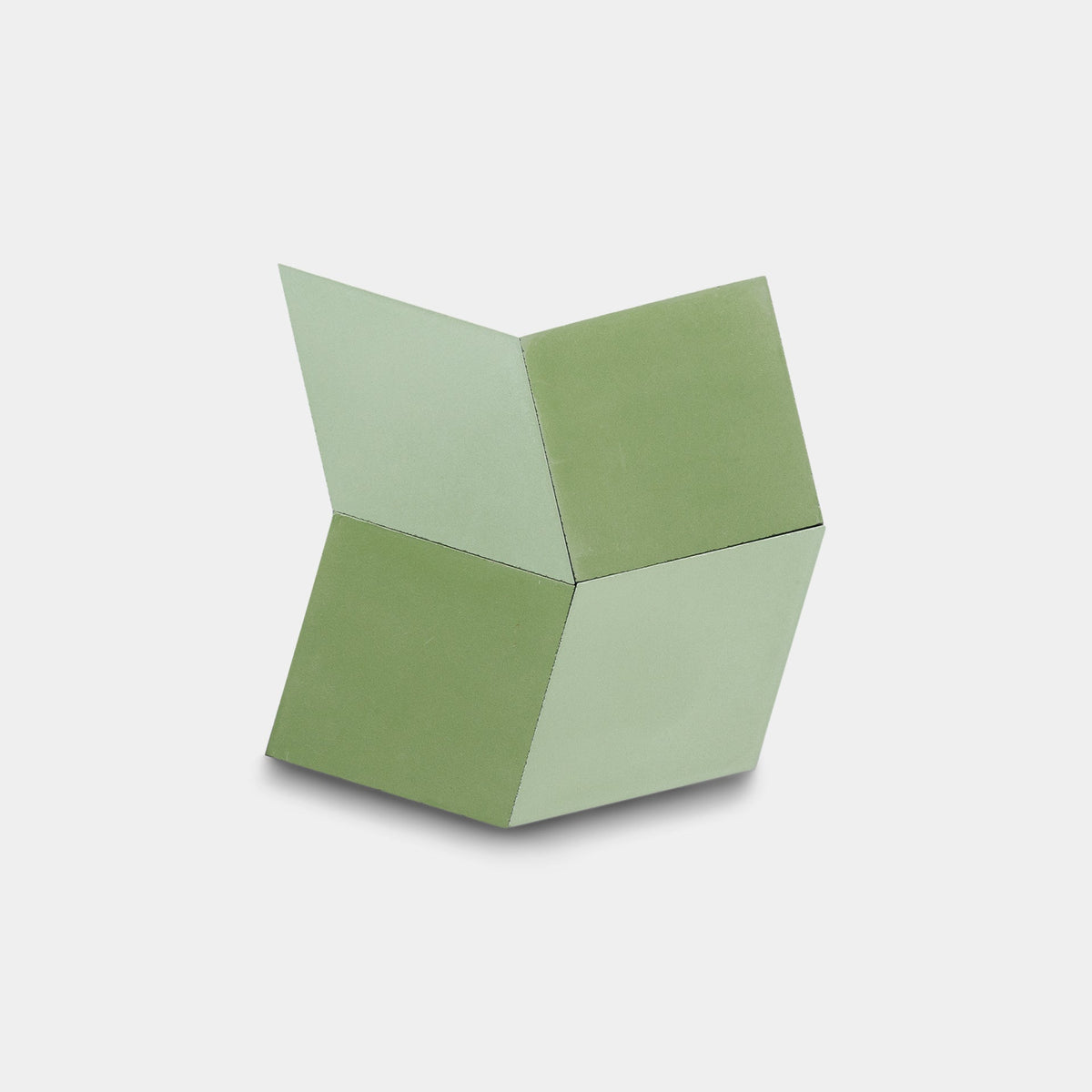 The Madrid Olivine + Nile, Sample by Zia Tile features three connected green and light green square panels forming a cube-like geometric sculpture, displayed on a plain white background.