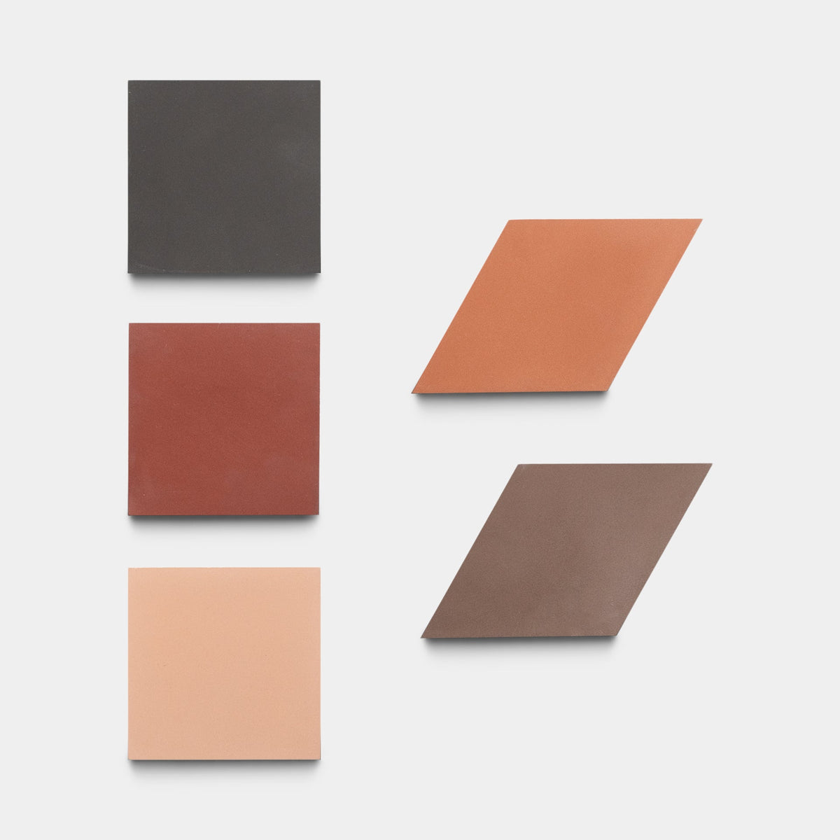 Six ceramic tiles from Zia Tile's Madrid Set One, Sample are arranged on a white background: three square tiles in dark brown, red, and light peach on the left, and three rhombus-shaped tiles in peach, brown, and taupe on the right.