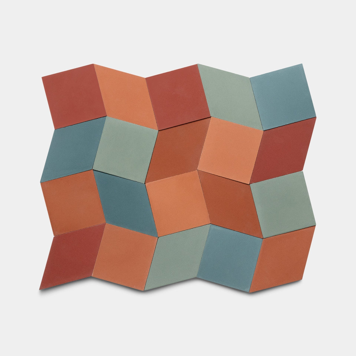 The Madrid Set Two Sample by Zia Tile features a geometric pattern of 3D cubes with square and parallelogram tiles in teal, terracotta, and muted green on white, inspired by the artisanal look of handmade Zia Tile designs.