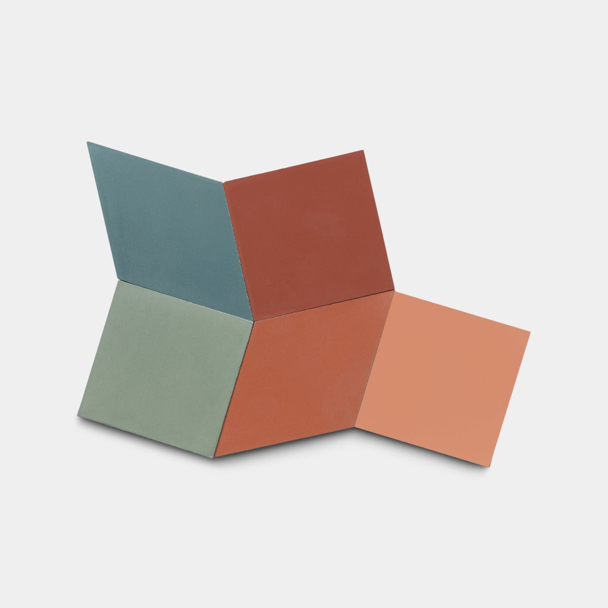 The Zia Tile Madrid Set Two Sample features four handmade tiles in teal, red, green, and peach, arranged in a three-dimensional geometric pattern on a white background.