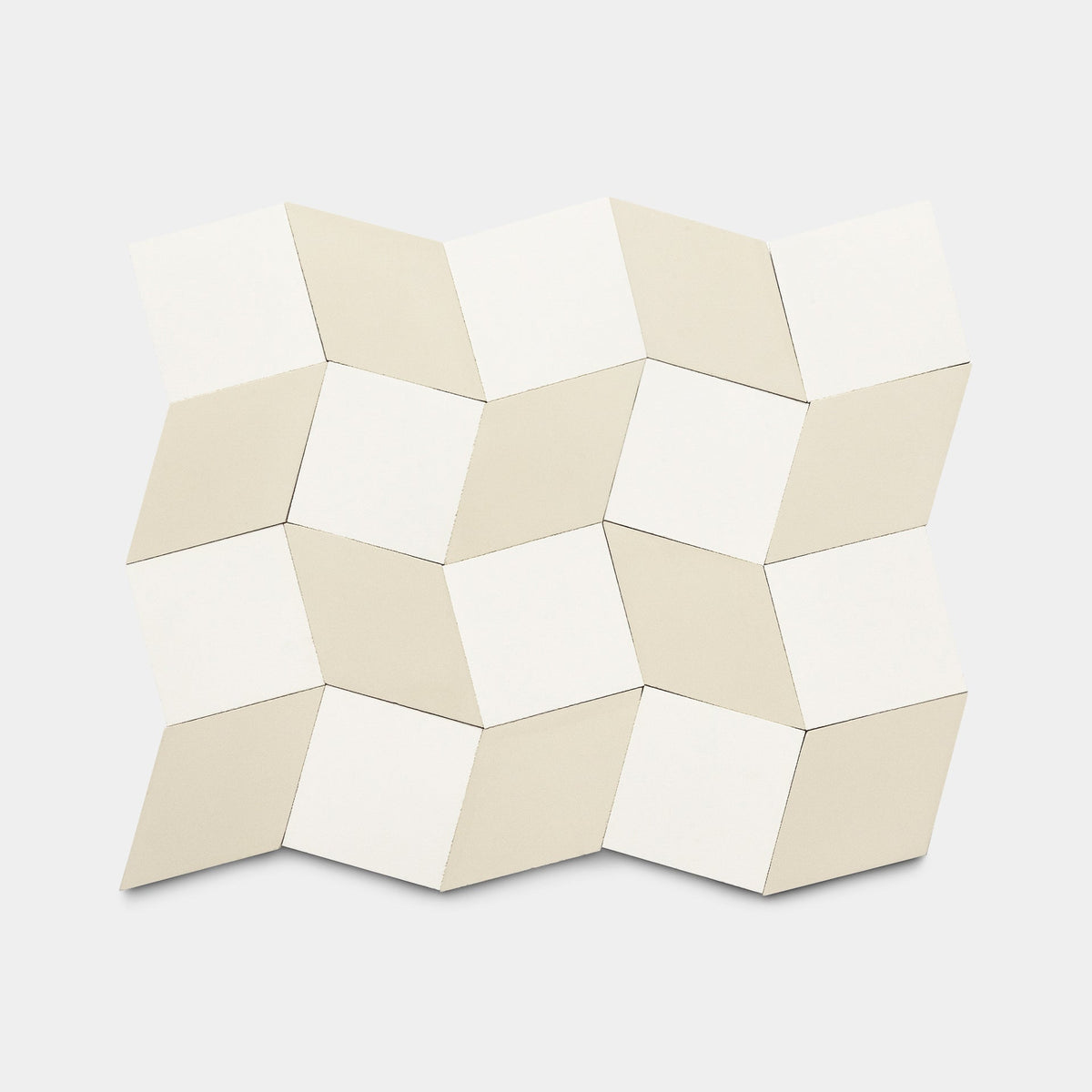 Madrid White + Bone cement tiles by Zia Tile feature a beige and white geometric pattern, creating a 3D cube illusion against a plain white background.