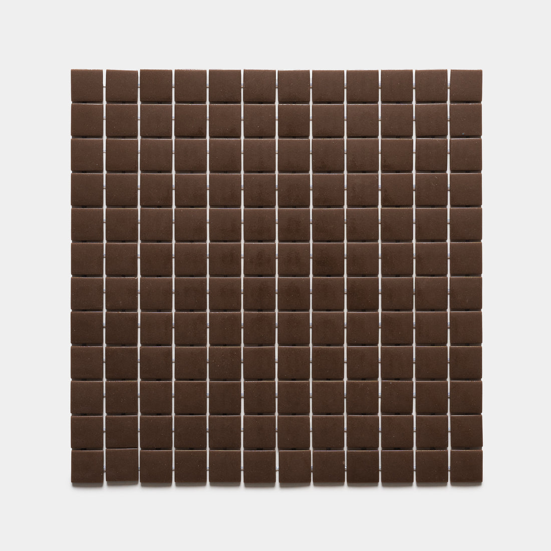 Neatly arranged rows and columns of Marmot 1x1, Sample by Zia Tile, forming a grid pattern of small, square, dark brown tiles on a plain white background.