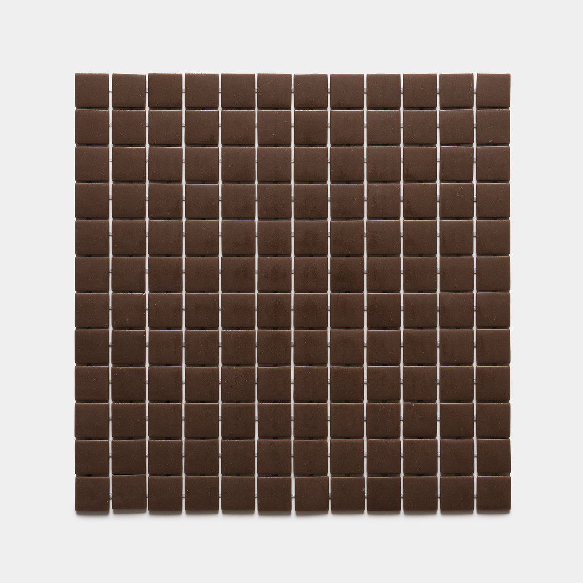 Neatly arranged rows and columns of Marmot 1x1, Sample by Zia Tile, forming a grid pattern of small, square, dark brown tiles on a plain white background.