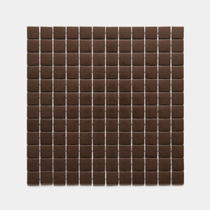 Neatly arranged rows and columns of Marmot 1x1, Sample by Zia Tile, forming a grid pattern of small, square, dark brown tiles on a plain white background.