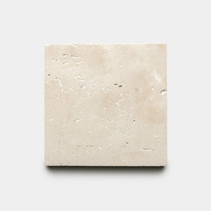 The Mesa 6x6 by Zia Tile is a single square beige tile featuring a textured surface with small natural holes, shown against a plain light gray background.