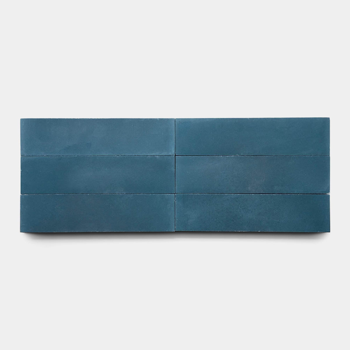 Six rectangular, matte dark blue Midnight 2x8 cement tile samples by vendor-unknown are arranged in two horizontal rows of three on a plain white background.
