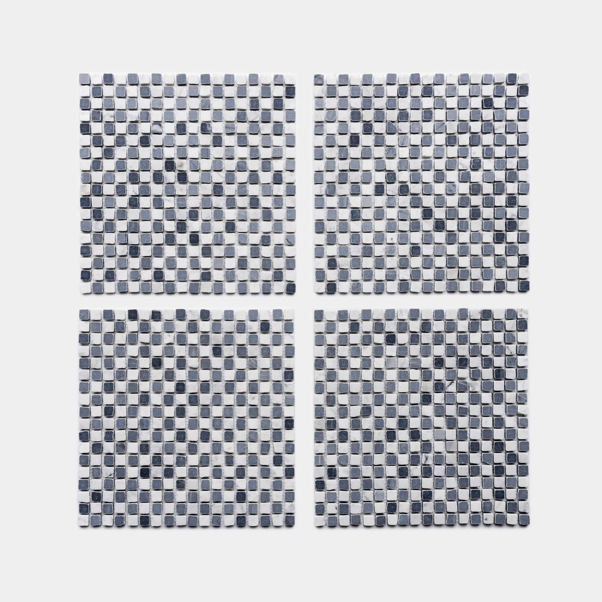 Four square sheets of Zia Tile's Mini Check in Carrara + Bardiglio Imperiale, featuring a checkerboard grid of small black, gray, and white tiles on a plain white background.