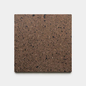 The Moab 12x12 tile by Zia Tile is a square brown stone tile featuring a speckled pattern of small black and white flecks, shown on a plain white background.