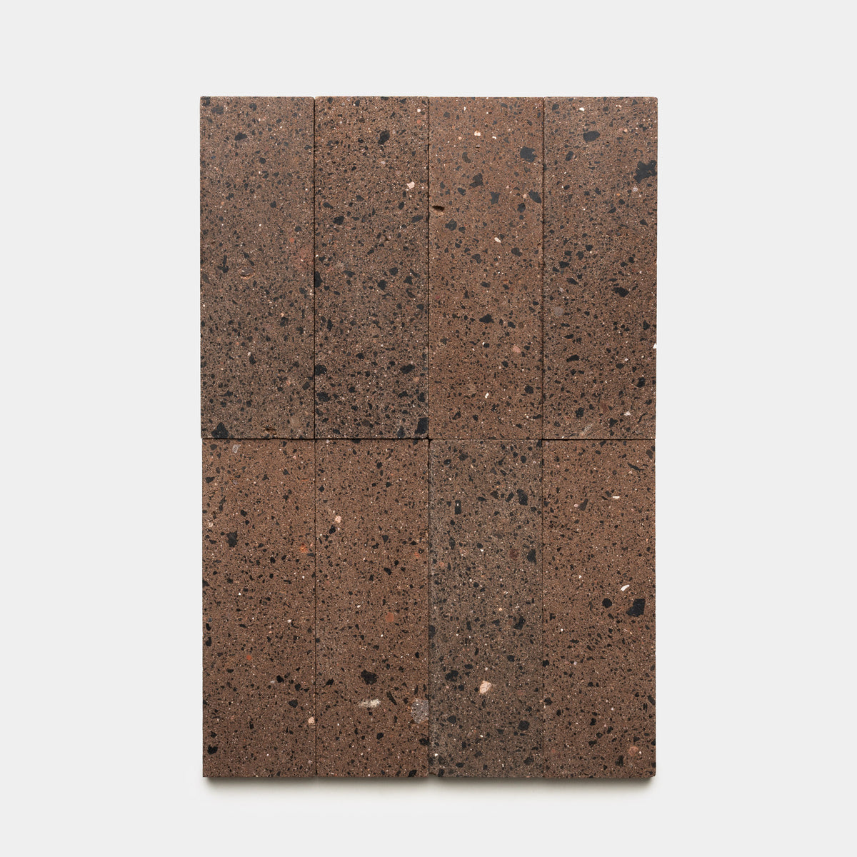 Nine rectangular Moab 4x12 tiles by Zia Tile, each featuring dark speckles, are arranged in three rows of three on a plain white background, highlighting the refined craftsmanship for which Zia Tile is known.