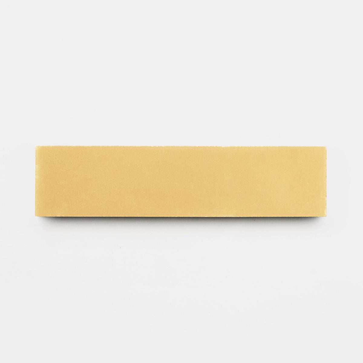 A rectangular Mojave 2x8 tile sample by vendor-unknown is centered on a plain white background, showcasing a smooth, handmade-inspired finish.