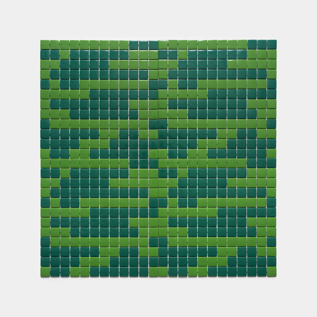 Murano Clover + Jasper by Zia Tile features a rectangular grid of small square tiles in alternating light and dark green shades, creating a striking pattern on a plain white background.