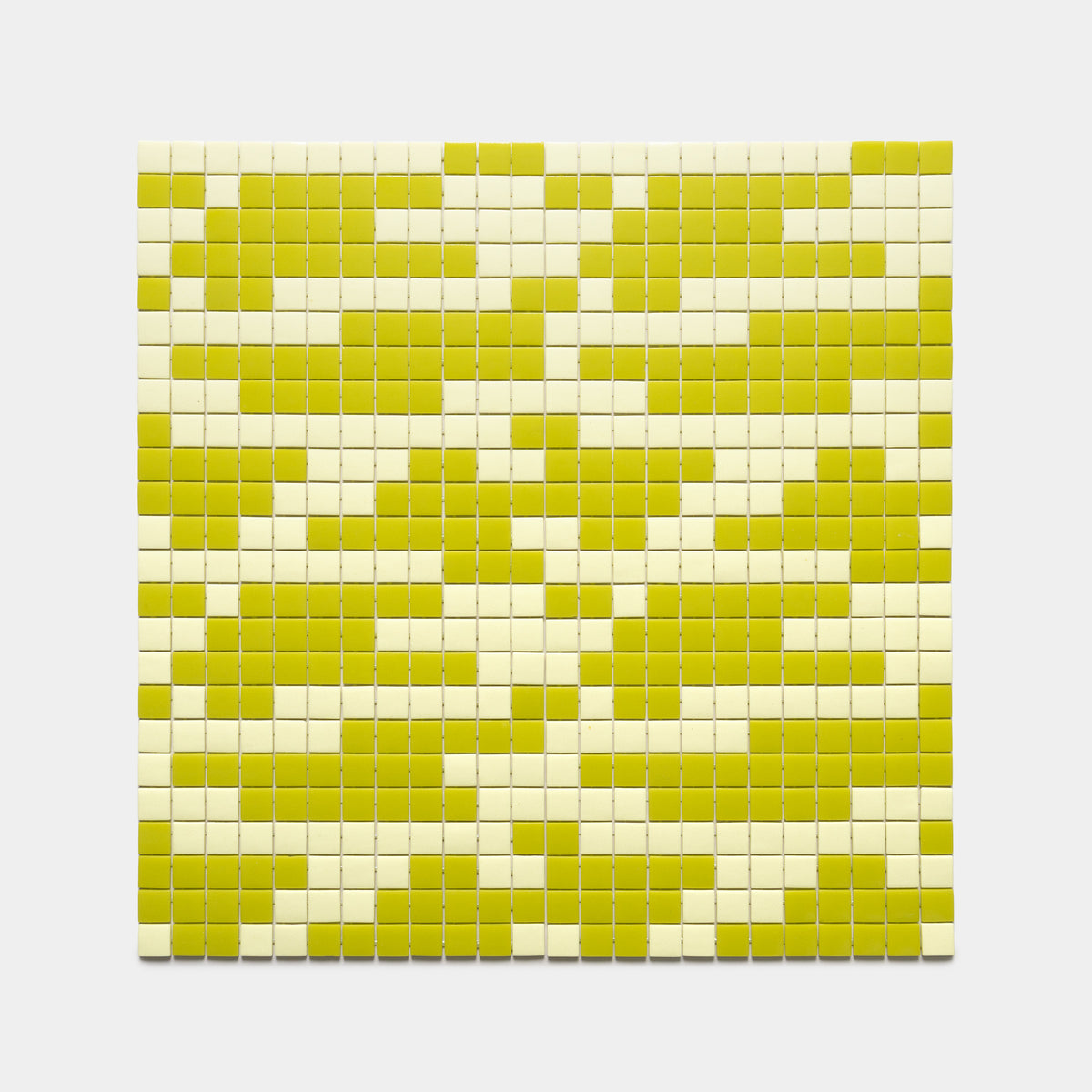 Murano Lemon Drop + Kiwi by Zia Tile features a grid of square tiles in alternating light yellow and greenish-yellow, creating an abstract, pixelated pattern on a white background.