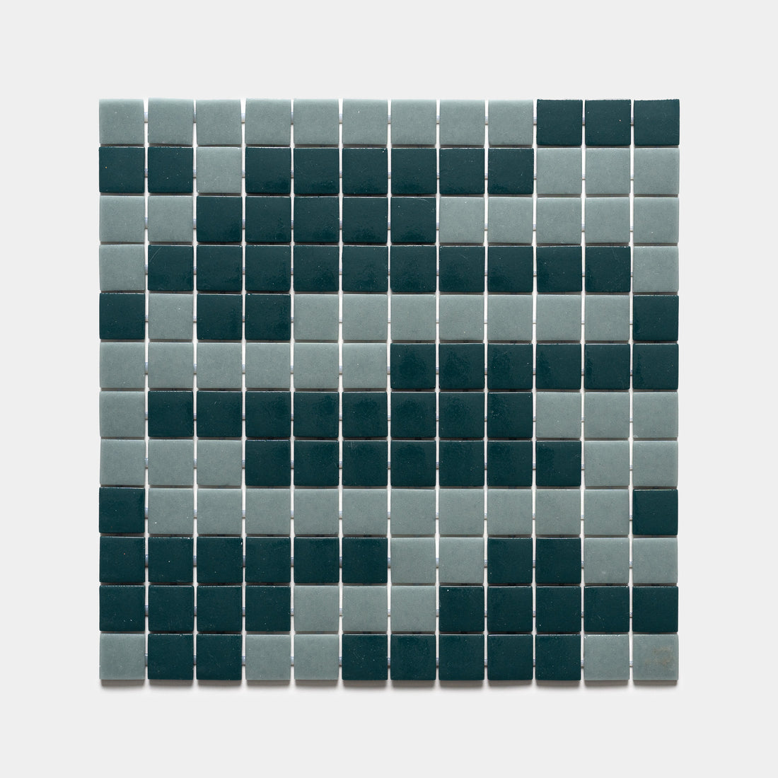 A square grid of Zia Tile's Murano Marine Layer + Vespertine Sample tiles forms a pixelated smiley face in dark teal and light gray on a white background.