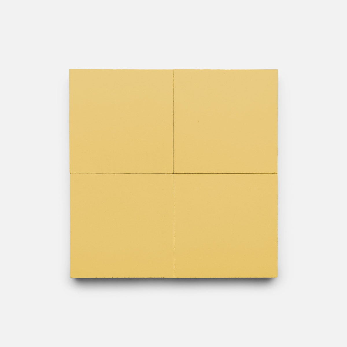 The Zia Tile Mustard 4x4 Sample features four equal, light yellow panels with subtle seams reminiscent of handmade tile, arranged in a square grid against a plain white background.