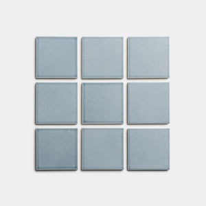 Nine Mystic 4x4 light blue square tiles by Zia Tile are arranged in a 3-by-3 grid on a plain white background.