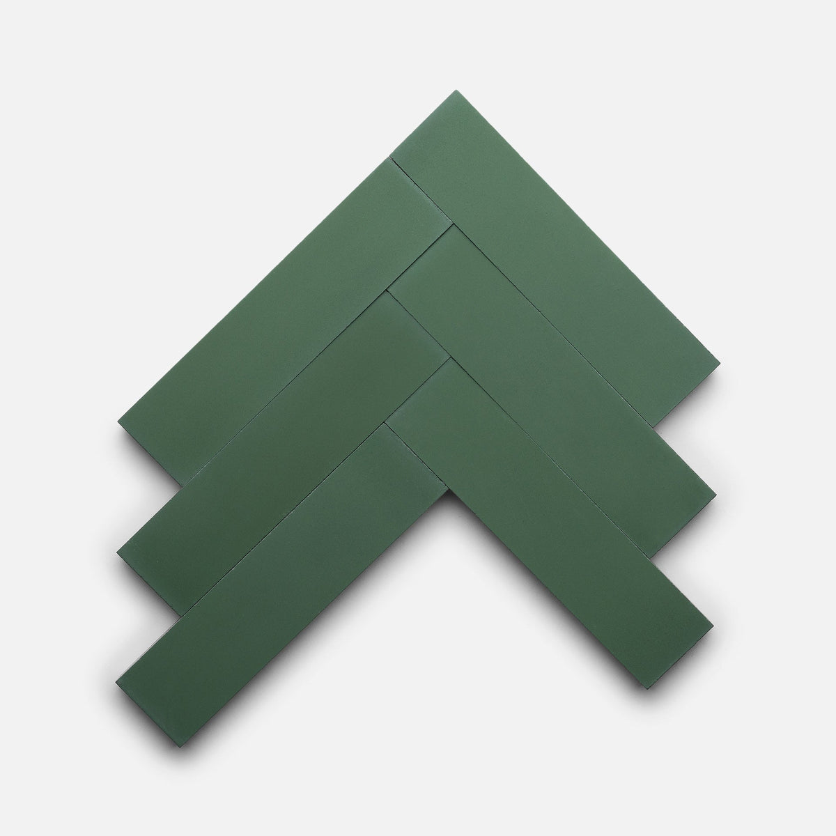 Five rectangular Noble Green 2x8 matte tiles by Zia Tile are arranged in a herringbone pattern on a plain white background.