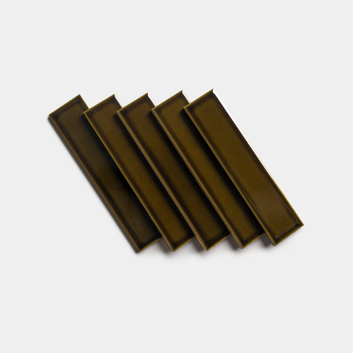 Five Oud 2x8 rectangular olive green ceramic tiles by Zia Tile are arranged in a fanned-out pattern on a white background.