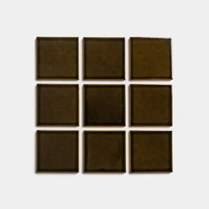 Nine Oud 4x4 square tiles by Zia Tile, in dark olive green, are arranged in a three-by-three grid on a plain light gray background.