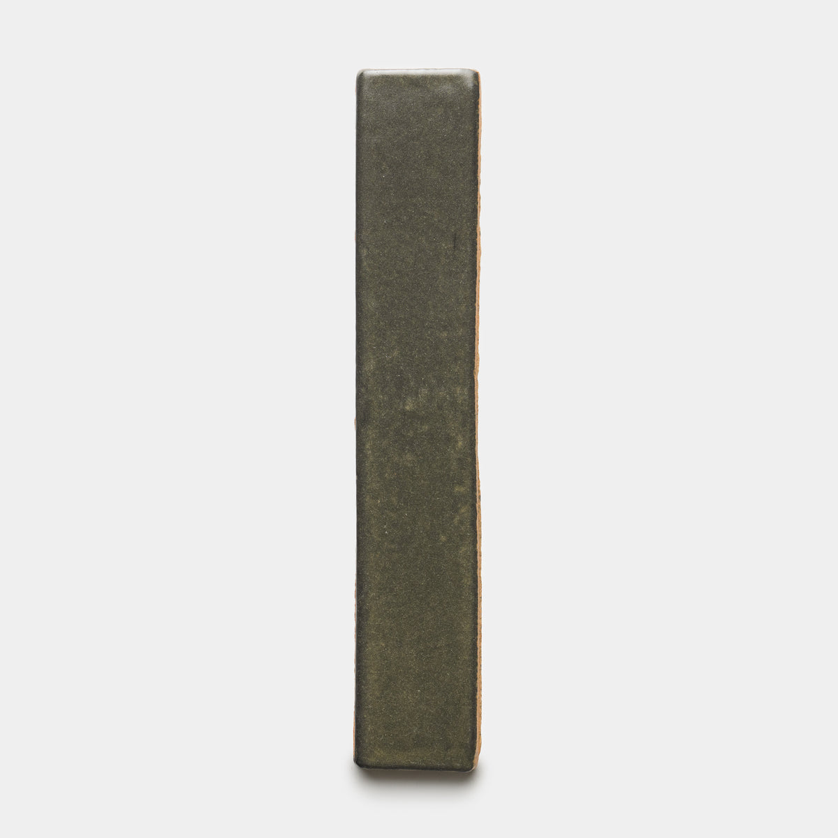The Oyamel Mini Bar by Zia Tile is a rectangular, dark-toned brick shown upright on its short end against a plain white background.