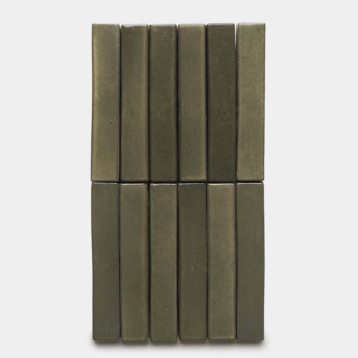 Twelve Oyamel Mini Bar tiles by Zia Tile, rectangular and olive-green, are arranged upright in two rows of six against a white background.