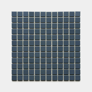 A square grid of Zia Tile's Pacific Blue 1x1 ceramic tiles features small, dark blue squares separated by thin white grout lines, arranged evenly against a plain light background.