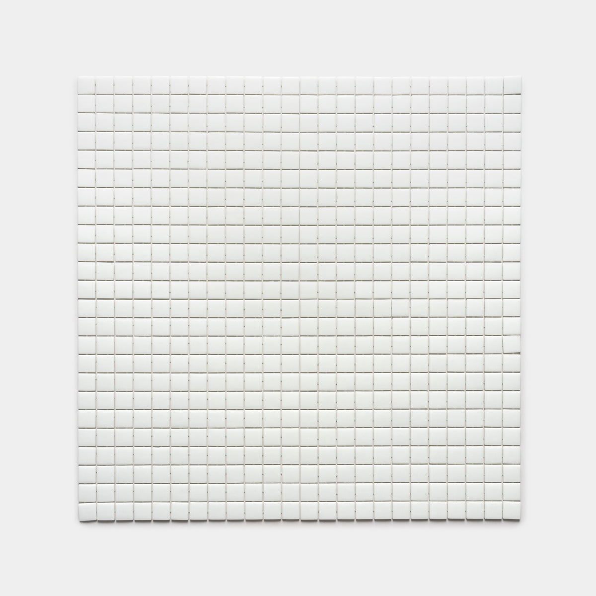 A square grid of Zia Tile’s Paperwhite 1x1 tiles, small, white, and evenly spaced on a plain white background.