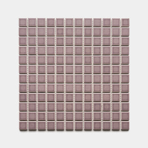 A square sheet of Zia Tile Patchouli 1x1 small, glossy mosaic tiles in mauve, arranged in a grid pattern on a white background.