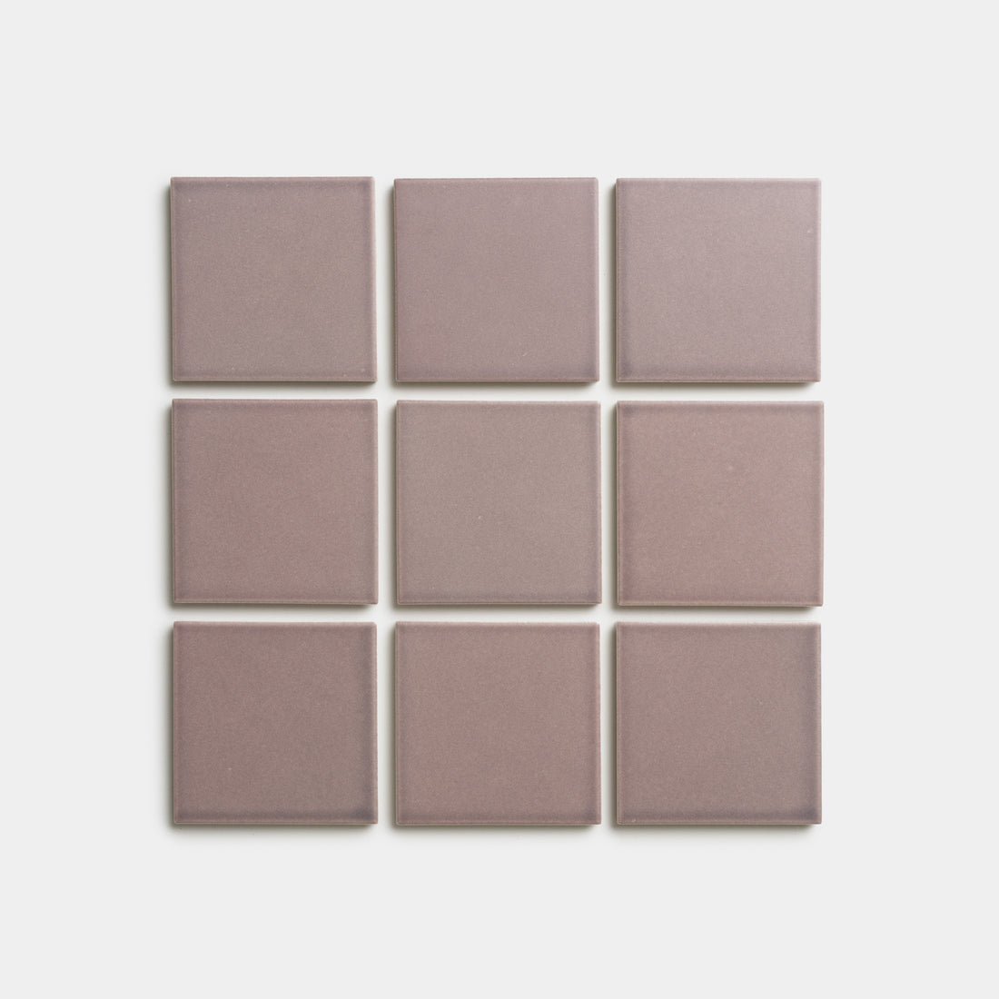 Nine Patchouli 4x4 tiles by Zia Tile, in a mauve square design, are arranged in a 3x3 grid on a white background.