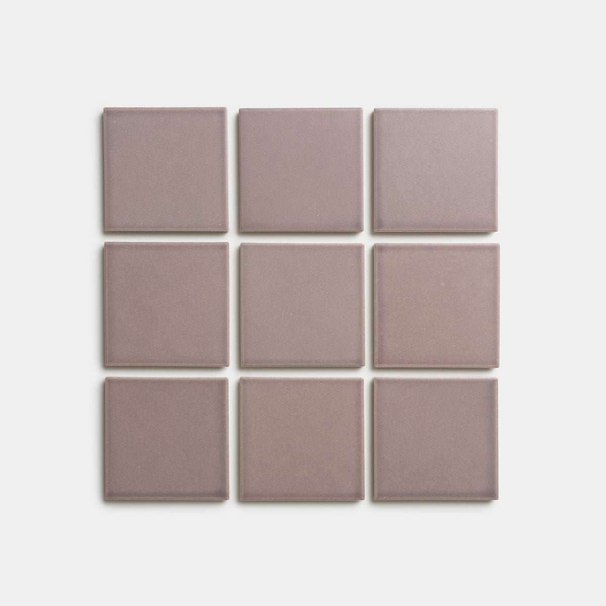 Nine Patchouli 4x4 tiles by Zia Tile, in a mauve square design, are arranged in a 3x3 grid on a white background.