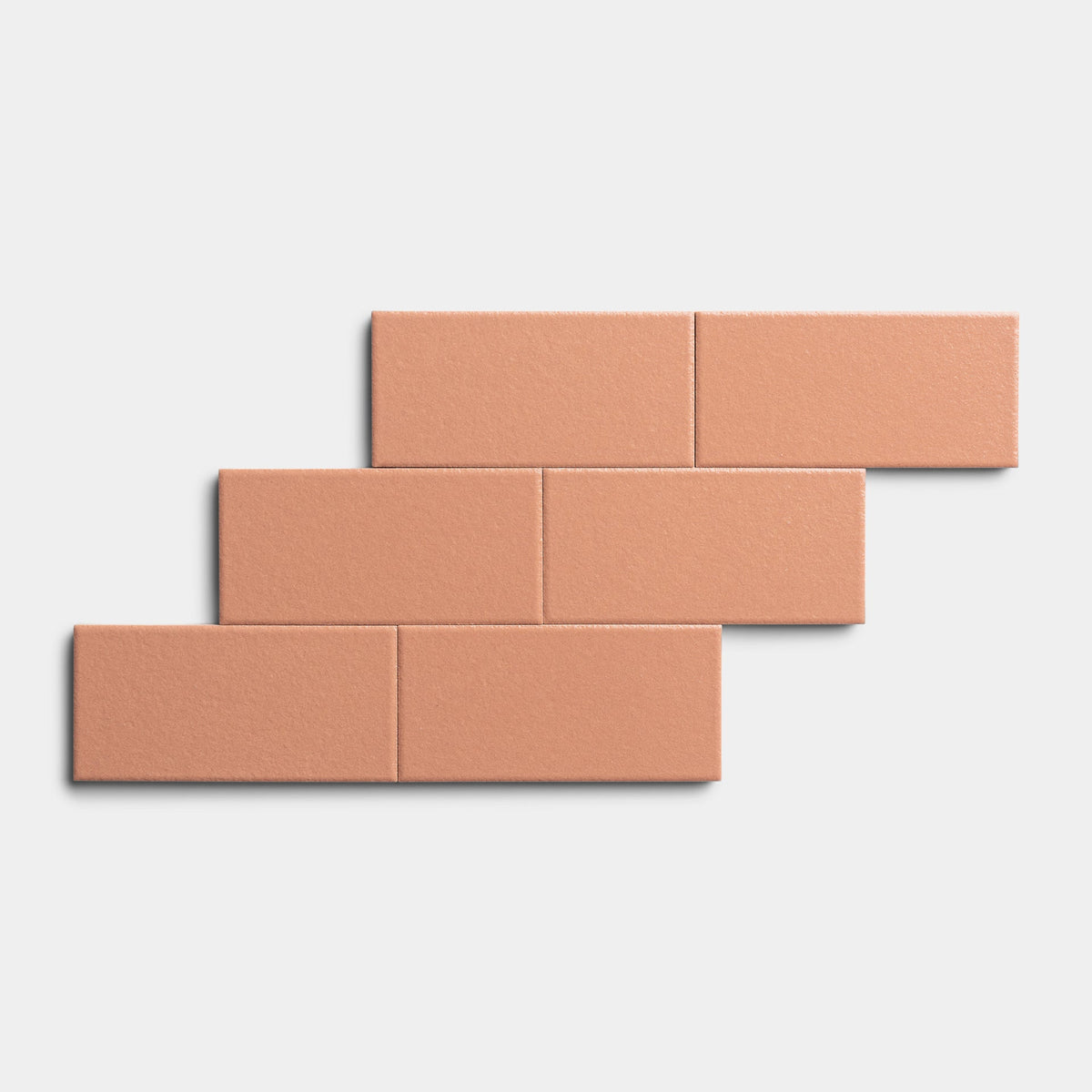 Six rectangular Pecan 2x4 tiles from Zia Tile are arranged in a staggered, stepped brick pattern on a white background.