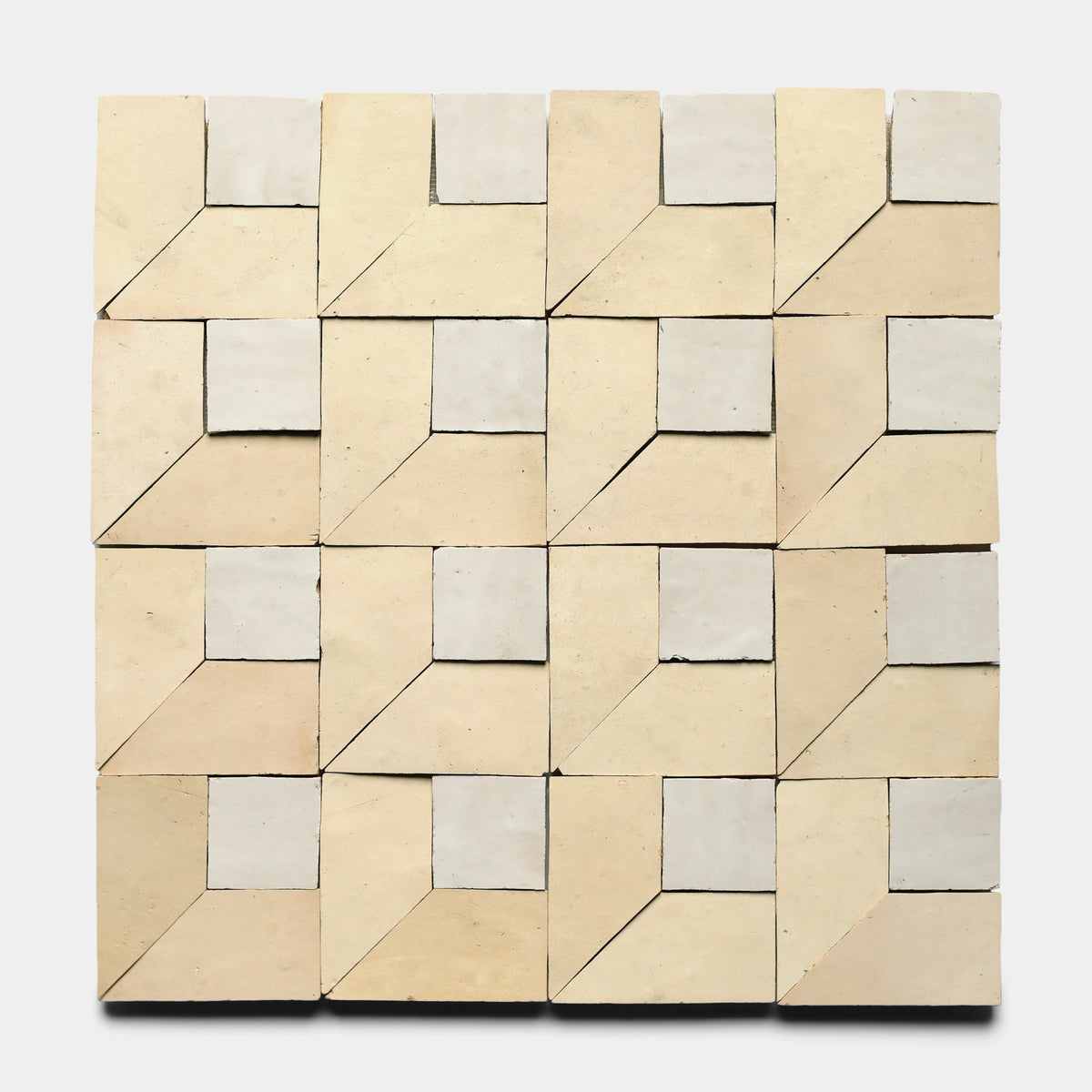 A 4x4 grid of square tiles, each handmade and divided into four sections. Beige and off-white tones form a geometric cube pattern on a white background. Inspired by Zia Tile's artisan style. Product: Perpetual Check 1, Sample by Zia Tile.
