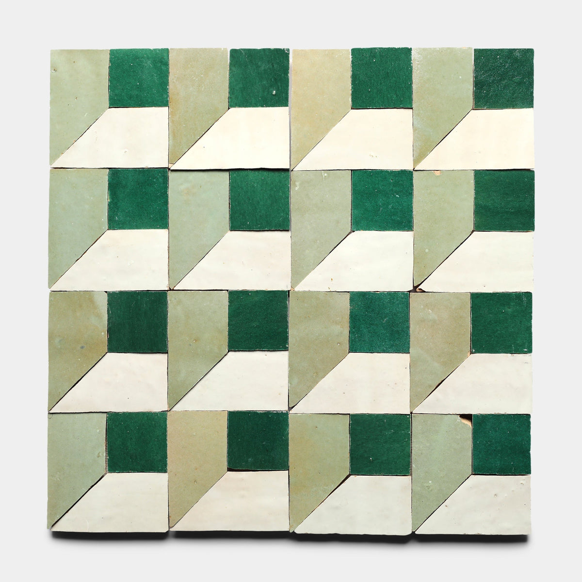 Perpetual Check 2, Sample by Zia Tile features a geometric tile pattern with repeating 3D cubes in green, cream, and off-white, set in a 4x4 grid and inspired by the artisanal look of handmade cement tile.