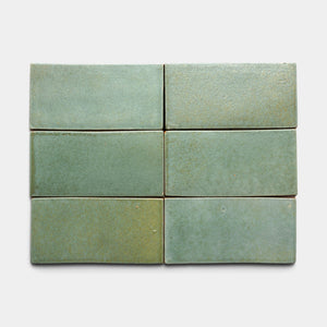 Six Peyote 4x8 Rectangle tiles by Zia Tile, in sage green ceramic with a matte finish, are arranged in two rows of three against a plain, light background.