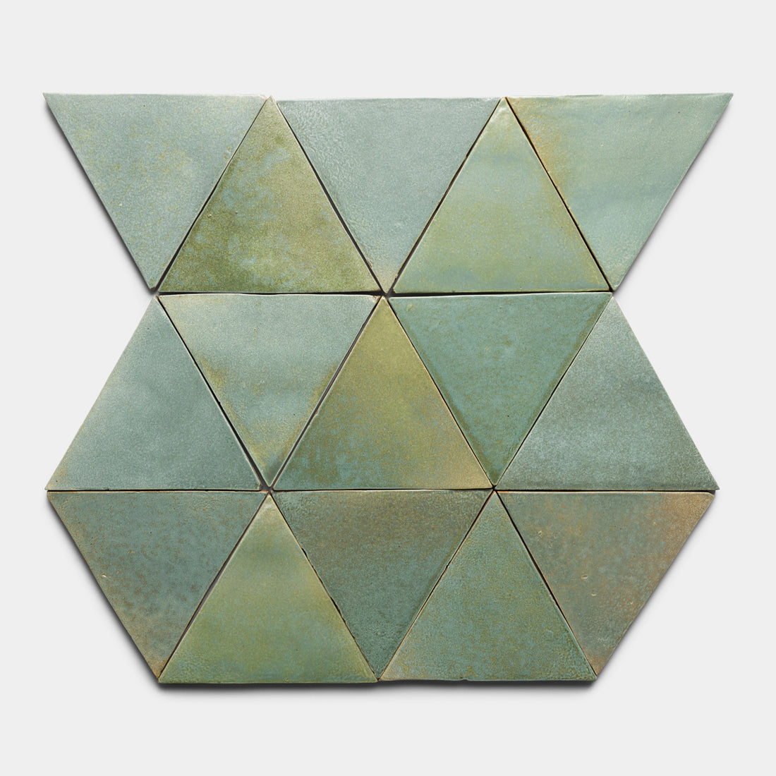 Twelve Peyote Triangle tiles by Zia Tile, in green ceramic, are arranged in three rows. Each equilateral triangle has a matte finish and subtle color variations, creating a geometric pattern.