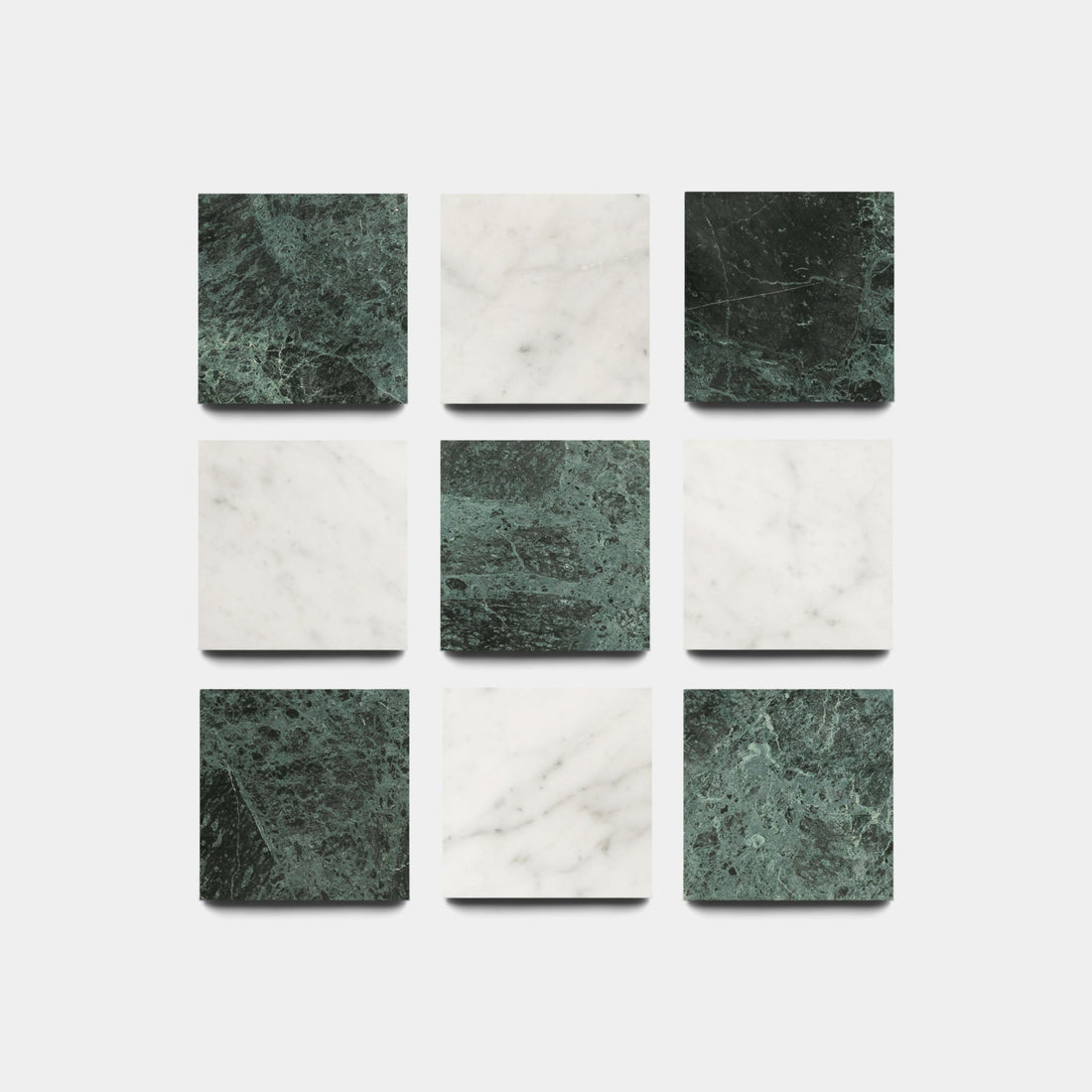 Nine Carrara + Verde Alpi 6x6 sample tiles from Zia Tile, arranged in a 3x3 grid with alternating dark green and white marble patterns, displayed on a white background.