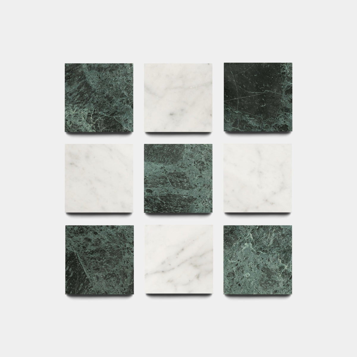 Nine Carrara + Verde Alpi 6x6 sample tiles from Zia Tile, arranged in a 3x3 grid with alternating dark green and white marble patterns, displayed on a white background.